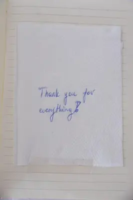a handwritten note on a piece of paper at Dolce Casa in Belgrade