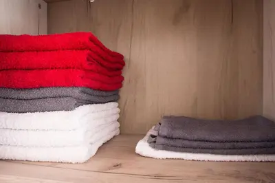 a group of towels are stacked on a wall at Dolce Casa in Belgrade