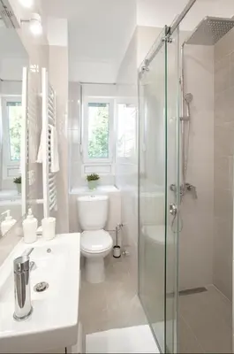 a white bathroom with a toilet and a shower at Victor Residence in Belgrade