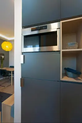 a kitchen with a stainless steel oven and cabinets at Victor Residence in Belgrade
