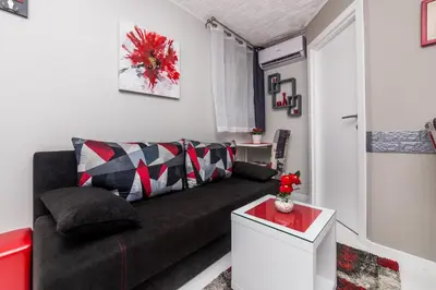 a living room with a couch and a table at Apartment Romanov in Belgrade