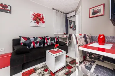 a living room with a couch and a table at Apartment Romanov in Belgrade