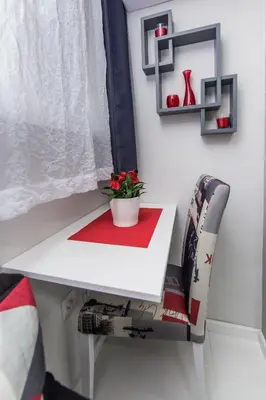 a table and a chair with a plant on it at Apartment Romanov in Belgrade