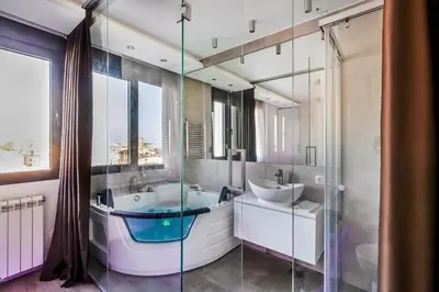 a bathroom with a tub and a sink at Luxury Boutique City Center Apartments in Belgrade