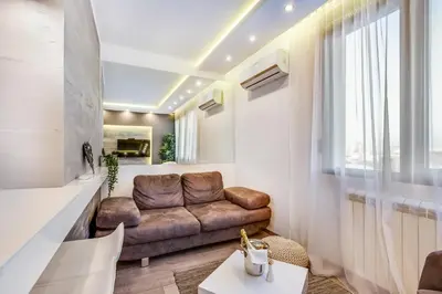 a living room with a couch and a table at Luxury Boutique City Center Apartments in Belgrade