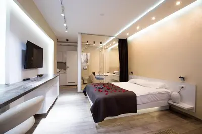 a bedroom with a large bed and a bathroom at Luxury Boutique City Center Apartments in Belgrade