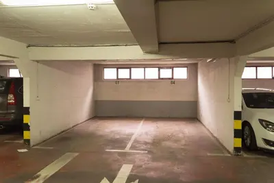 an empty parking garage with cars parked in it at Skadarlija City Break in Belgrade