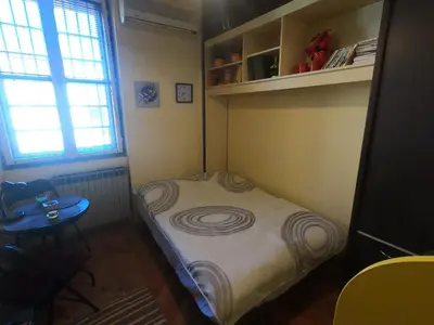 a small room with a small bed in it at Aprtman Sonja 2 in Belgrade