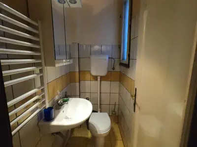 a small bathroom with a toilet and a sink at Aprtman Sonja 2 in Belgrade