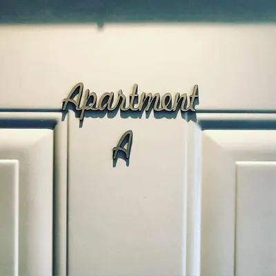 a refridgerator with the word aquarium written on it at Apartment A in Belgrade