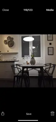 a kitchen with a table with chairs and a dining room at Apartment A in Belgrade