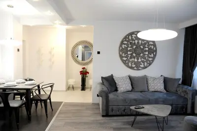 a living room with a couch and a table at Apartment A in Belgrade