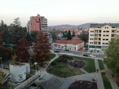 a view of a city with buildings and a street at Apartman LENA in Arandjelovac