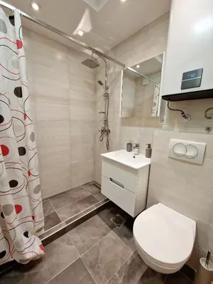a bathroom with a toilet and a sink at Apartmani Paku in Belgrade