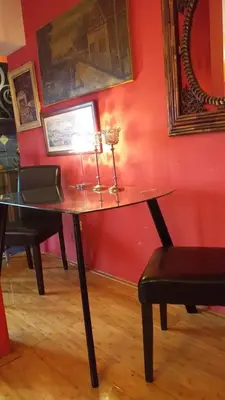 a desk in a room with a red wall at LOVE in Belgrade