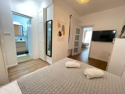 a bedroom with a bed with two towels on it at Apartment 42 - City Center in Belgrade