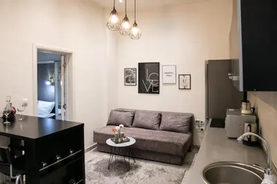 a living room with a couch and a sink at Natalie's Place in Belgrade