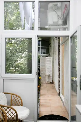 a room with a door and a hallway with a porch at Natalie's Home in Belgrade
