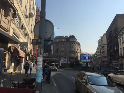 a street with cars parked on the side of the road at Natalie's Home in Belgrade