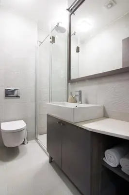 a bathroom with a sink and a toilet and a shower at Omia in Belgrade
