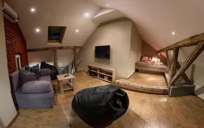 a living room with a couch and a bed at Central Park Apartments in Belgrade