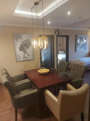 a dining room with a table and chairs at Apartments Exclusive in Belgrade