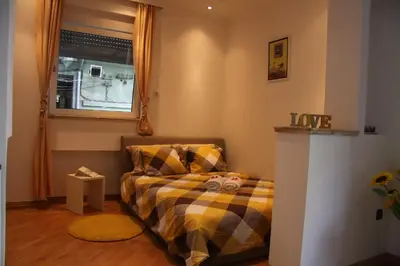a bedroom with a bed and a window at St. Marko Church App in Belgrade