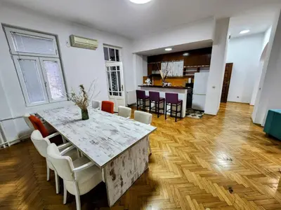 a kitchen and dining room with a marble table and chairs at BUDGET - Authentic Belgrade Centre Apartment #4, 3 Bedrooms, 1 full Bathroom, 1 Toilet in Belgrade