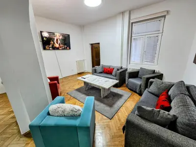 a living room with couches and a table at BUDGET - Authentic Belgrade Centre Apartment #4, 3 Bedrooms, 1 full Bathroom, 1 Toilet in Belgrade
