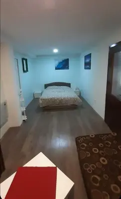 a bedroom with a bed in the middle of a room at Juliana in Belgrade