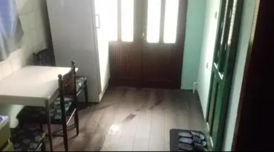 a room with a table and chairs and a door at Juliana in Belgrade