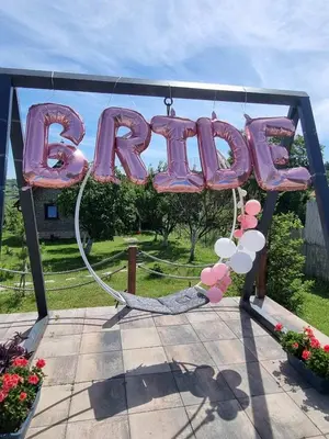 a sign that says b party with pink and white balloons at Vila Stancevic wellness in Sremski Karlovci
