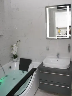 a bathroom with a bath tub and a sink at Spa Panorama in Belgrade