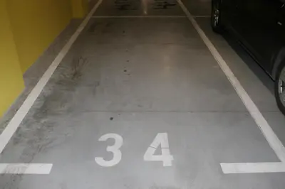 a parking garage with the number thirtyfour painted on the floor at Spa Panorama in Belgrade
