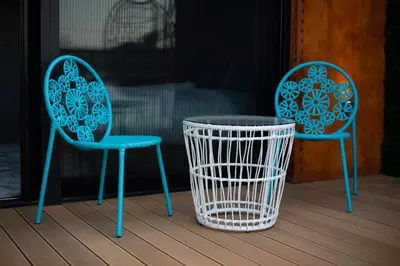 two chairs and a table on a porch at FLOW in Belgrade
