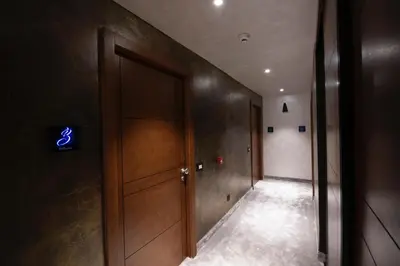 a hallway with a door with a sign on it at FLOW in Belgrade