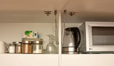 a kitchen with a counter top with a microwave at Momo 123 Apartments in Belgrade