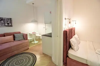 a living room with a couch and a table at Momo 123 Apartments in Belgrade