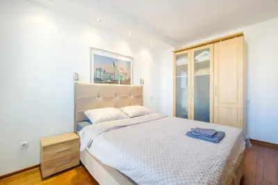 a bedroom with a large bed and a window at BB´s Apartment&Unterkunft in Belgrade