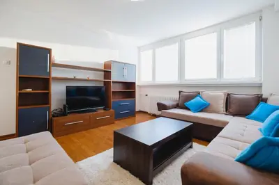 a living room with a couch and a tv at BB´s Apartment&Unterkunft in Belgrade