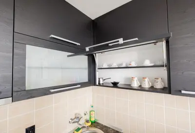 a bathroom with a sink and a shelf with shoes at BB´s Apartment&Unterkunft in Belgrade