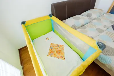 a childs bed with a cot in a room at BB´s Apartment&Unterkunft in Belgrade