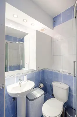 a bathroom with a white toilet and a sink at BB´s Apartment&Unterkunft in Belgrade