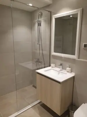 a bathroom with a sink and a shower at Belgrade Waterfront-Delux apartman Beograd na vodi in Belgrade