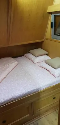 two beds in a cabin on a boat at Free Room Boat Apartment in Belgrade