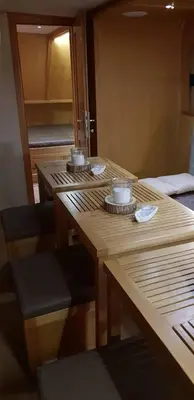 a group of tables with cups on top of them at Free Room Boat Apartment in Belgrade