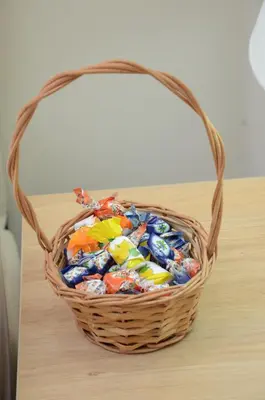a basket of candy is sitting on a table at Stella Apartments in Belgrade