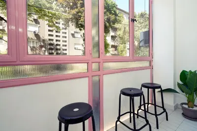 a pair of stools sitting in front of a window at Tulum Apart Belgrade in Belgrade
