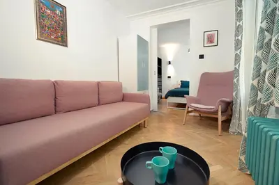 a living room with a couch and a table at Tulum Apart Belgrade in Belgrade