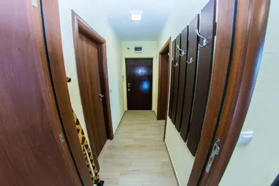 a hallway with wooden doors and a hallway with a hallway at Panorama View Belgrade in Belgrade